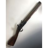 An 18th Century brass-barrelled flintlock blunderbuss by I Hall, having a 16" barrel, octagonal at