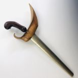 A Malayan kris / dagger, having carved hardwood grip, serpentine blade with characteristic pamor,