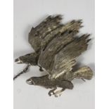 A silver brooch cast and engraved as two soaring eagles, the badge of RAF 11 Squadron, and