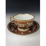 A Barr, Flight and Barr period Worcester teacup and saucer, gilded with a repeating foliate motif