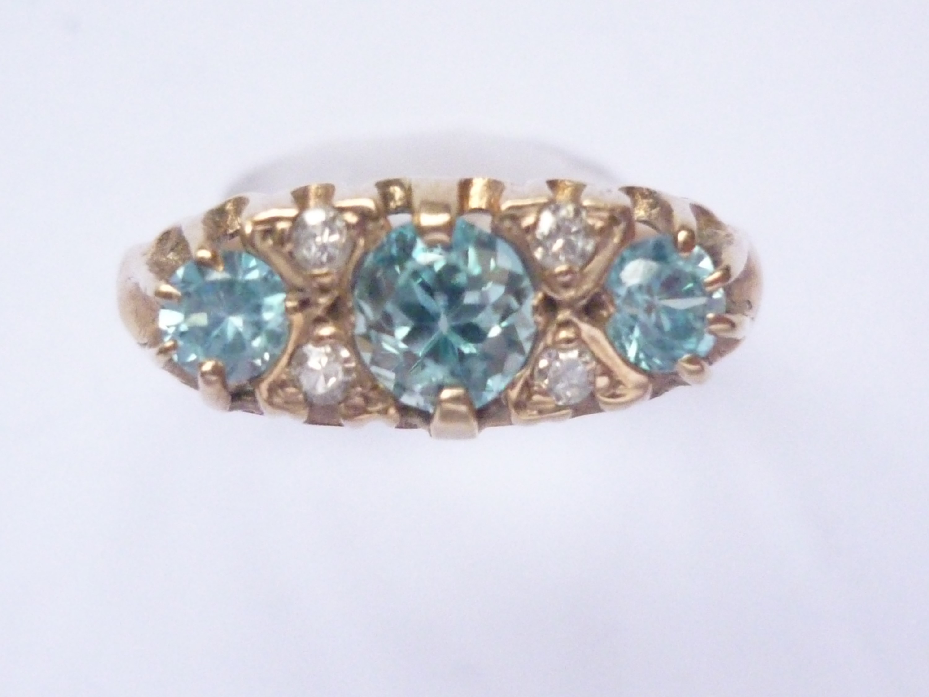 A blue zircon and diamond dress ring