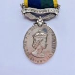 A QEII Territorial Efficiency Medal, (markings partially erased)