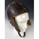 A Great War or earlier leather hard-shell driving / flying helmet by "Motorist's Equipment of