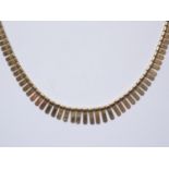 A 9ct gold fringe necklace, with bright-cut decoration, 17g