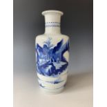 A Qing Chinese porcelain blue-and-white landscape rouleau vase, 24 cm