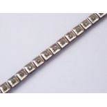 A vintage 9ct gold and diamond 'tennis' bracelet, having square-section links, the face of each