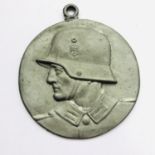 A German Third Reich patriotic cast alloy medallion, 6.5 cm