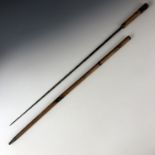 A 19th century turned and scorched beech faux-bamboo sword stick, concealing a single edged and