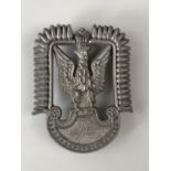 A Second World War Free Polish Air Force plastic cap badge