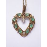 A 9ct gold, diamond and emerald pendant necklace, in the form of a heart-shaped wreath pellet-set
