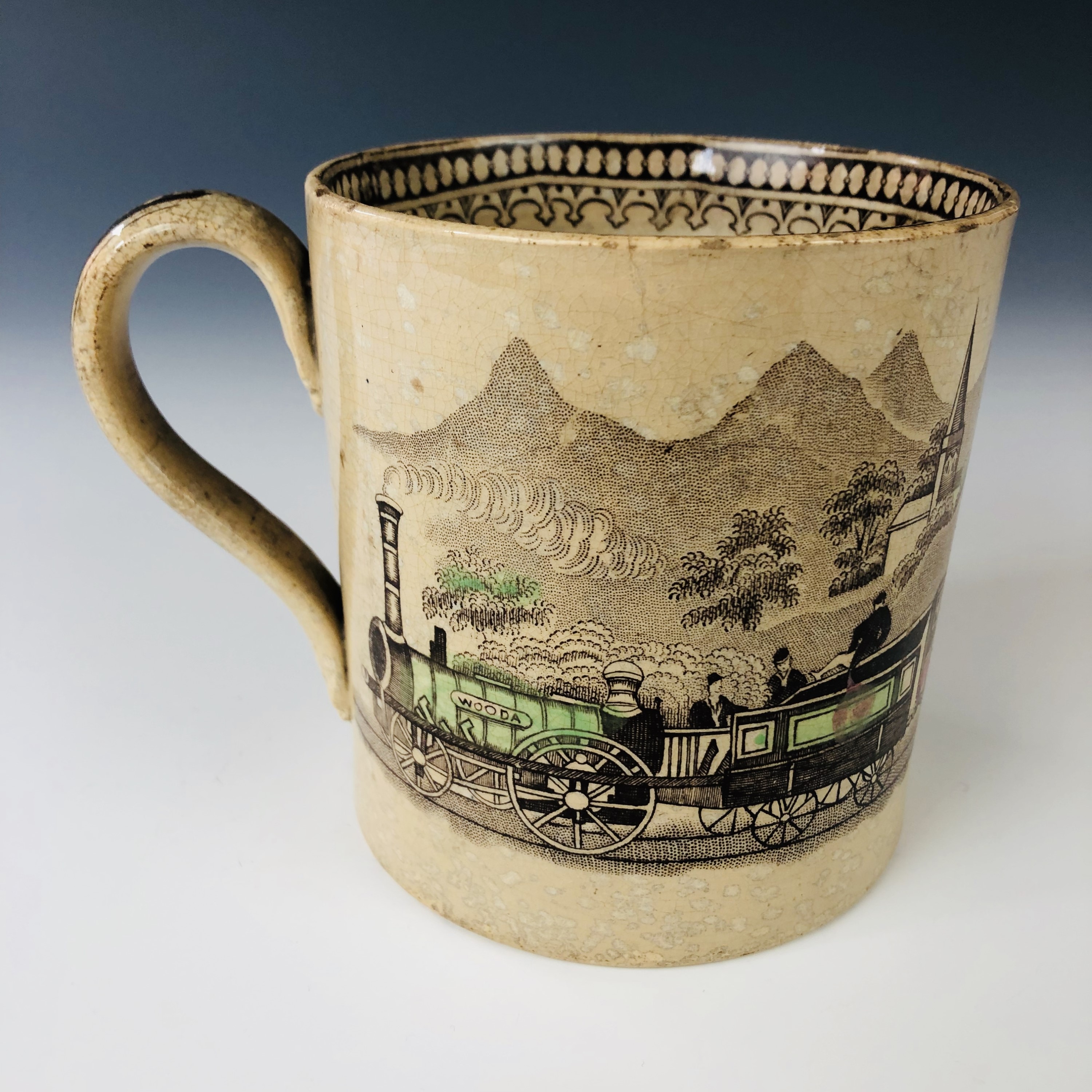 A mid 19th century Staffordshire pottery railway pattern mug, decorated in the round with a - Image 2 of 3