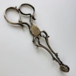 A pair of Georgian silver scissor-action sugar nips, with an engraved monogram, indistinct smith's