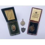 Four Royal Navy silver fob medallions