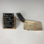Two data plates recovered from Luftwaffe aircraft, one bearing a label with inscription "Engine