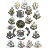 A quantity of Sherwood Foresters and related badges and titles