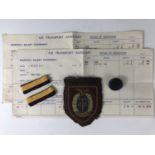 An Air Transport Auxiliary blazer badge, shoulder rank insignia, button and salary documents