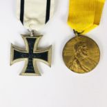 An Imperial German 1914 Iron Cross second class together with a Prussian Kaiser Wilhelm centenary