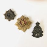 A Second World War Royal Scots plastic cap badge and two other badges, (former a/f)