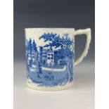 An early 19th century blue and white transfer-printed pearlware tankard, depicting an oriental