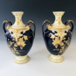 A pair of Bernardaud Limoges oviform vases, each having an everted rim, a pair of bifurcated