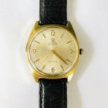 A gentleman's gold-plated Omega wrist watch, having a radially brushed and silvered face, baton