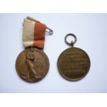 A Fascist Italian medal and one other commemorating the entry of Allied armies into Naples on the