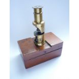 A Victorian pocket drum microscope in mahogany case, 7.5 cm high