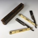 A cased pair of Regency cut-throat razors, by Priest, having pique worked ivory grip scales, each