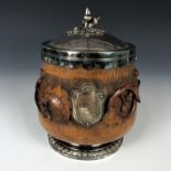 A carved oak and electroplate mounted tobacco jar bearing a plaque with engraved inscription "