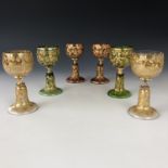 A set of six Moser style Bohemian wine glasses, variously coloured, each having a "trumpet" stem and