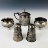 An Indian white-metal five-piece cruet set retailed by Dass and Dutt of Calcutta, comprising