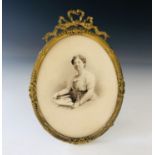 A Belle Epoque ormolu oval photograph / picture frame, with reeded and moulded bell-flower