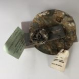 A Battle of Britain wreck-recovered Luftwaffe Dornier 17 fuel hatch and an instrument dial,