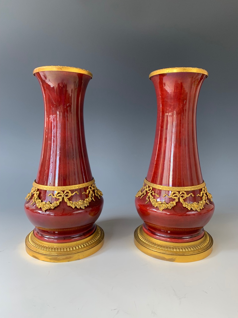 A pair of 19th century Sevres sang de boeuf vases by Paul Milet, of shouldered baluster form, with