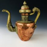 A 19th century Tibetan copper and brass dragon tea pot / ewer, 28 cm
