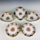 A Wedgwood Etruria dessert service, comprising ten plates and four shaped comports, in an Imari
