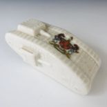 A Great War Arcadian crested china model of a tank, bearing the arms of the City of Newcastle on