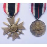 A German Third Reich War Merit Cross with swords, second class, together with a War Merit Medal