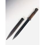 A German Third Reich S84/98 bayonet, stamped S/242 and dated 1936, in associated scabbard