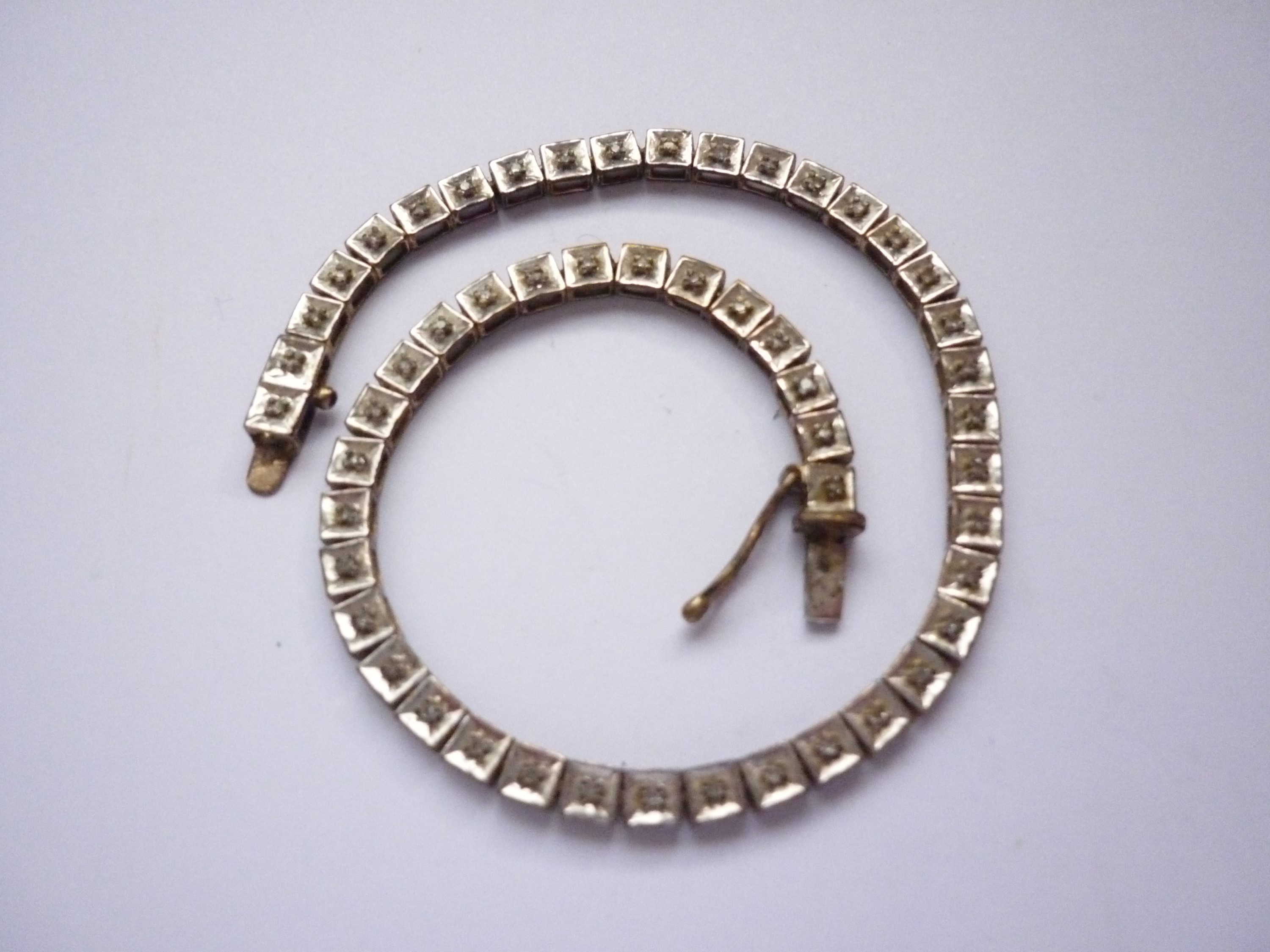 A vintage 9ct gold and diamond 'tennis' bracelet, having square-section links, the face of each - Image 2 of 2