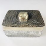 An Edwardian Arts and Crafts silver-mounted cut-glass trinket box, of rectangular section, the