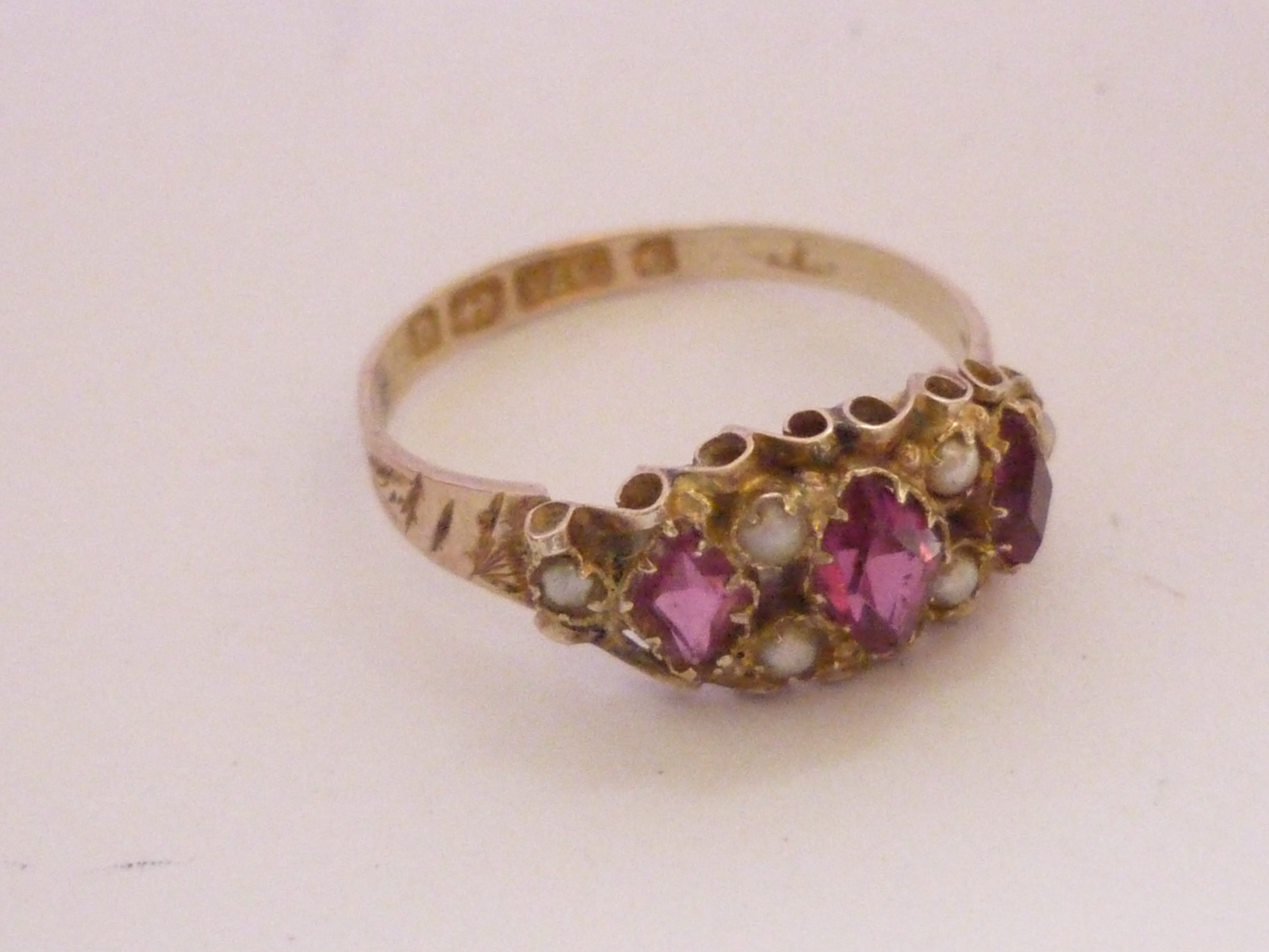 A Victorian almandine garnet and seed pearl dress ring, the open face set with three rhombus-cut - Image 3 of 3