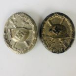 German Third Reich wound badges in silver and gold, the latter numbered 81 verso