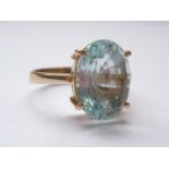 An aquamarine and yellow-metal (tested as gold) dress ring, the oval-cut aquamarine, of