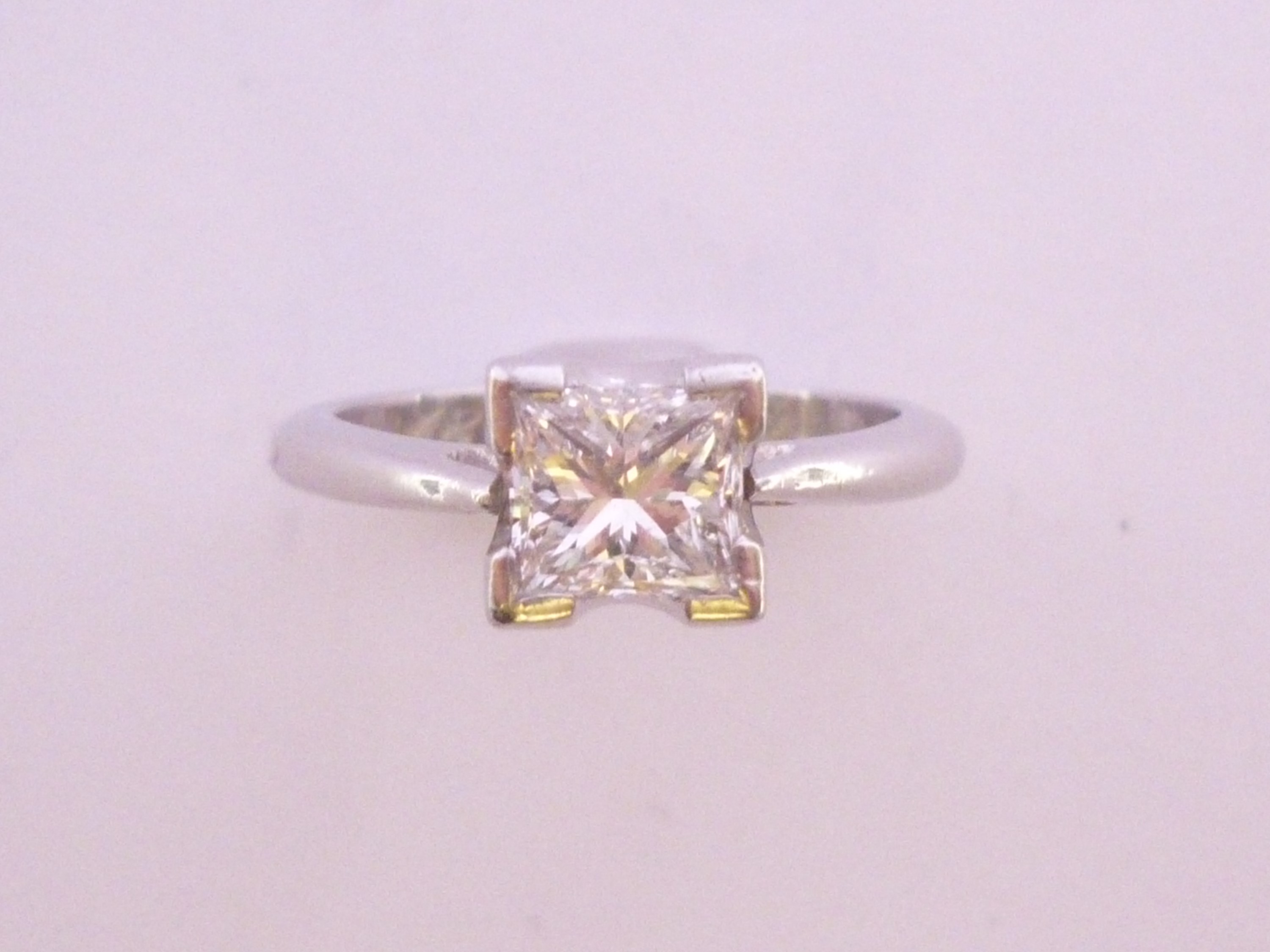 A contemporary platinum and princess-cut diamond solitaire ring and matching wedding band, the - Image 2 of 2