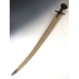 An 18th / 19th Century Indian tulwar sword, the blade bearing chiselled script, blade 75 cm