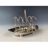 An Edwardian silver novelty toast rack, the five partitions spelling out the word 'Toast', S W Smith