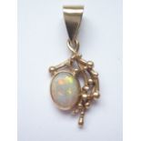 A 9ct gold and opal pendant, the opal cabochon, of approximately .78ct, bezel set and suspended