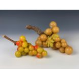 Two bunches of uncommonly large alabaster grapes on wooden stems, 20th Century, respectively 37 cm