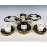A 19th century porcelain part tea and coffee service, comprising tazza, sandwich plate, nine tea
